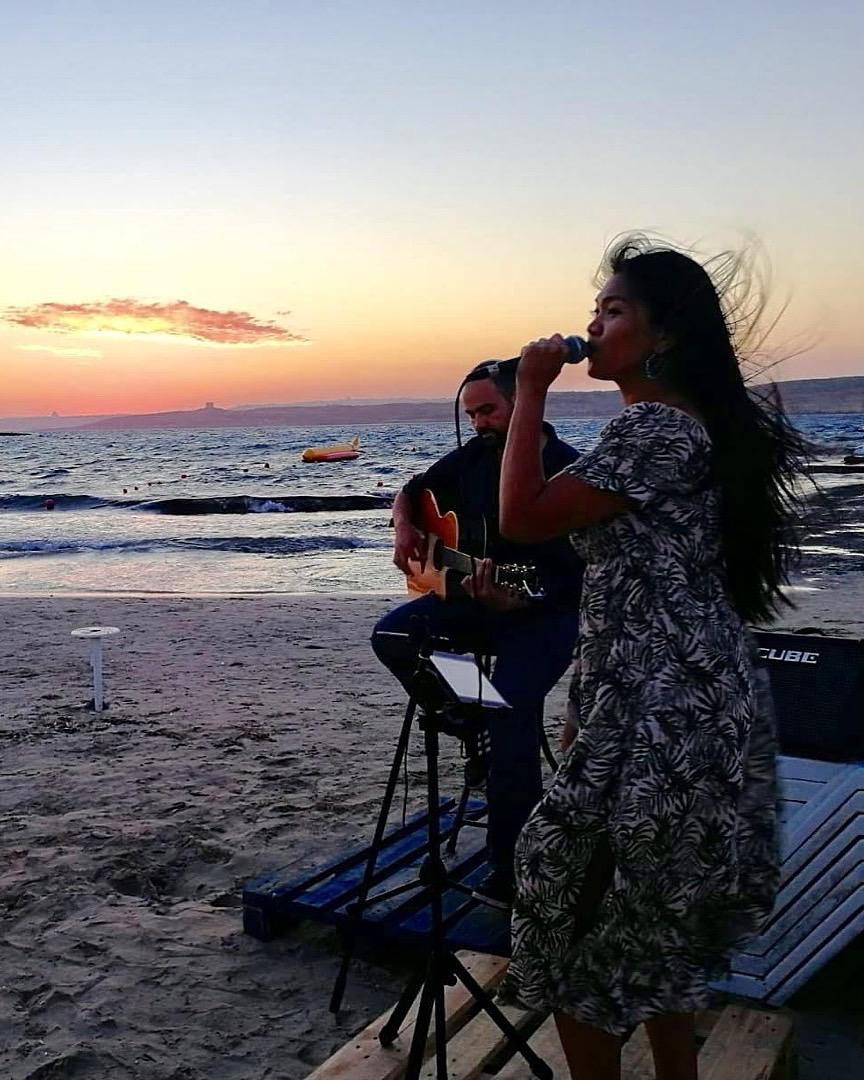 Nadine wedding singer at a beach event